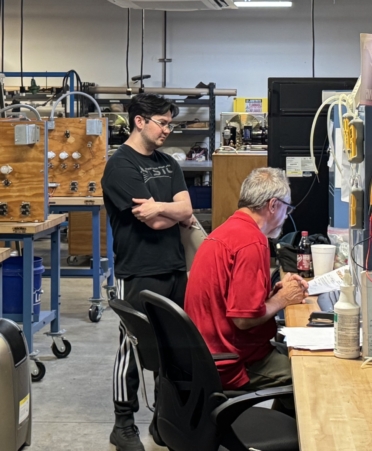 TSTC HVAC Technology student Austin Dacillo, left, reviews an assignment in the HVAC Technology lab with HVAC Technology instructor Curtis Christian at the college’s Williamson County campus. (Photo courtesy of TSTC.)