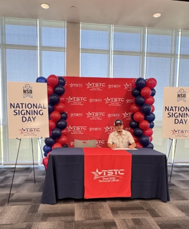 Taylor High School senior Miguel Morales signs a letter of intent to attend TSTC’s Williamson County campus for Welding Technology during the National CTE Letter of Intent Signing Day event at TSTC’s Williamson County campus on April 10.