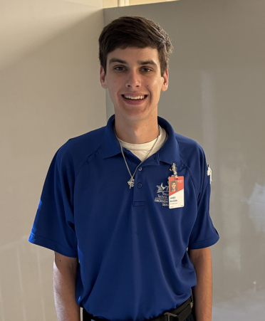 man in blue EMT shirt