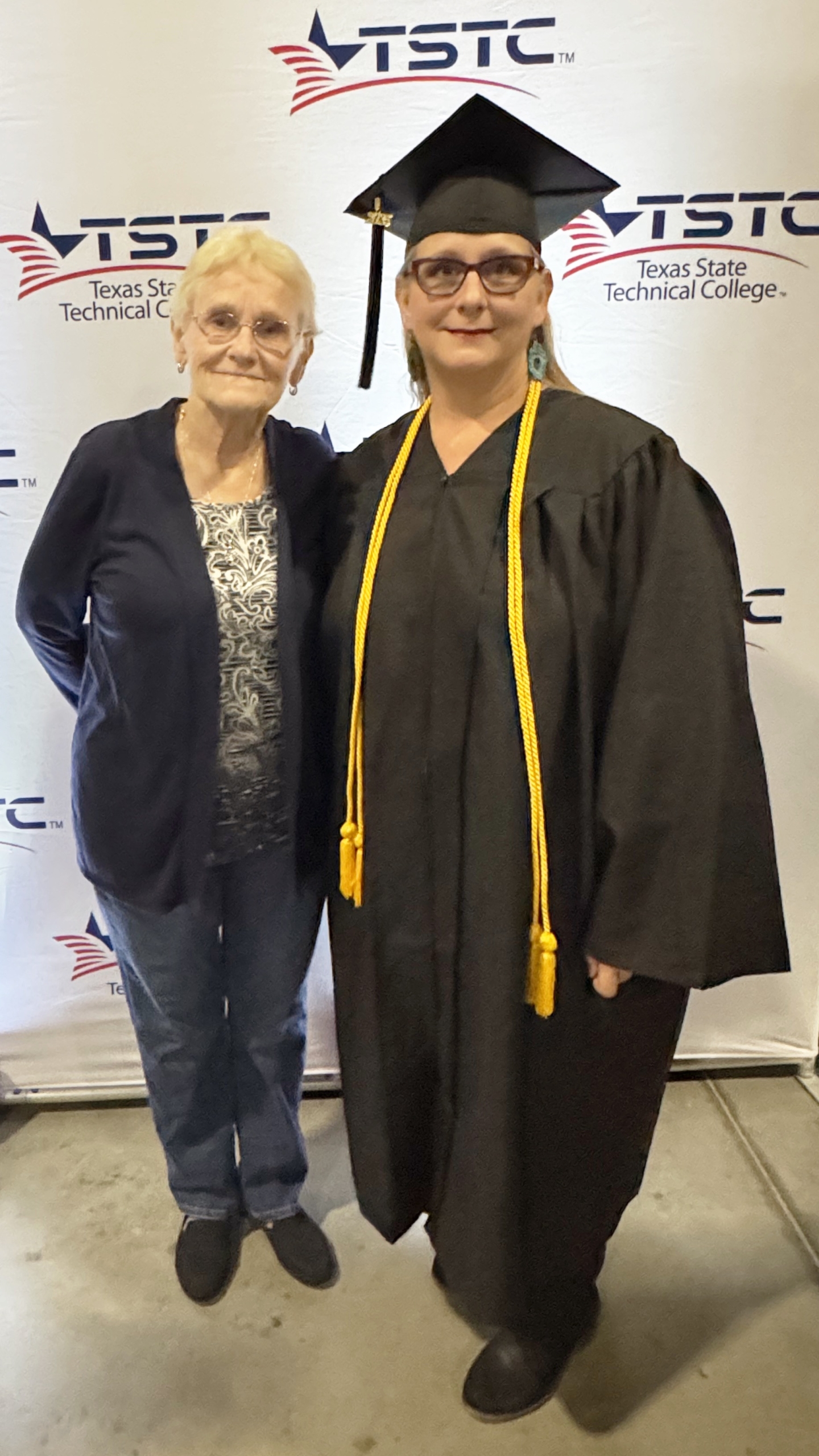 TSTC Chemical Dependency Counseling graduate Lori Fitzgerald, right, and her mother, Barbarah McClain, at the Williamson County commencement ceremony at the Williamson County Expo Center on May 7. (Photo courtesy of TSTC.)