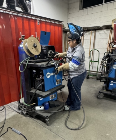TSTC Welding Technology student Paulina Maldonado prepares equipment to begin welding during a recent lab session on the Williamson County campus. (Photo courtesy of TSTC.)