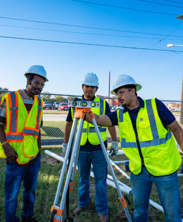 plumbing students in safety vest