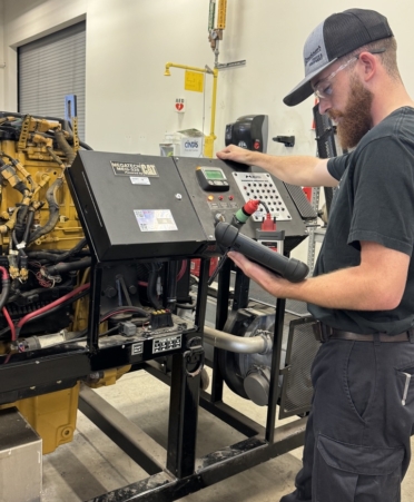 Nathan McDivit, a Diesel Equipment Technology student at TSTC’s North Texas campus, balances his time between his education, his family, and a job at a truck shop. (Photo courtesy of TSTC.)