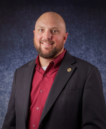 man in red shirt and sports coat