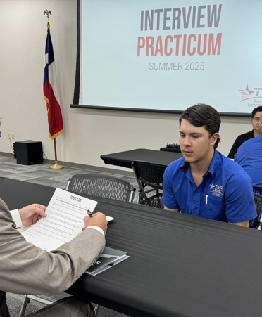people participating in mock job interviews