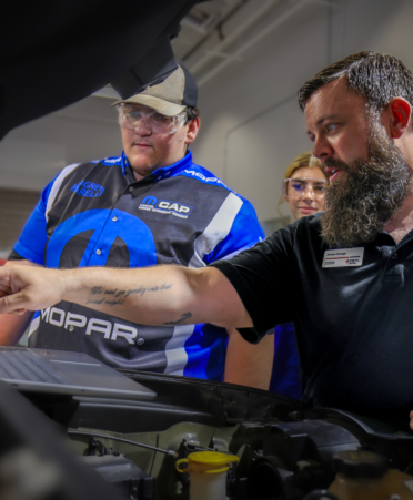 Photo caption: Joseph Strange, right, a Mopar Career Automotive Program instructor at Texas State Technical College’s Waco campus, works with students during a recent lab session on alternators. (Photo courtesy of TSTC.)