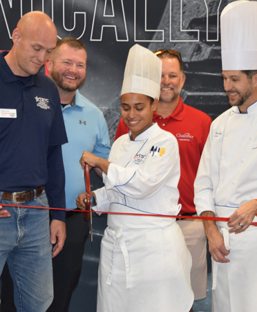 chefs cutting ribbon