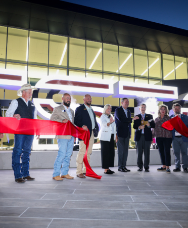 a group of people at a grand opening