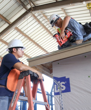 Texas State Technical College Building Construction students Raul Cortez (right) and Nathan Rostro work on sheathing a roof during a recent lab.