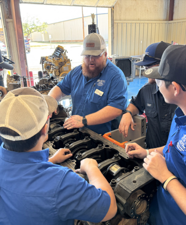 Group of men in a diesel shop