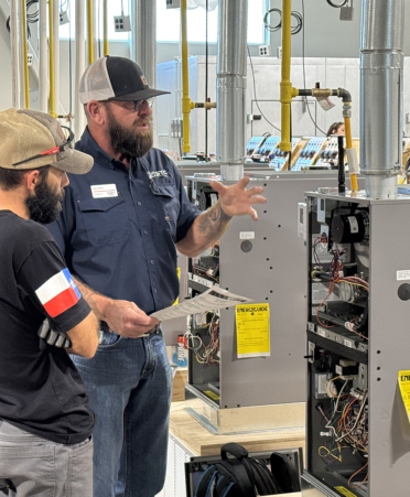 student and instructor in a HVAC lab