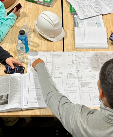 Photo caption: One of the first skills that students in Texas State Technical College’s Building Construction program learn during the first semester is blueprint reading. (Photo courtesy of TSTC.)