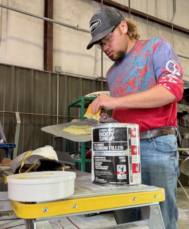 Photo caption: Brendon Mercer, of Gonzales, mixes body filler in an auto refinishing lab at Texas State Technical College’s Waco campus. (Photo courtesy of TSTC.)