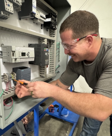 Luke Clasby, an Industrial Maintenance student at Texas State Technical College’s North Texas campus, is working as an environmental specialist intern for Oncor, and is about to be a father. (Photo courtesy of TSTC.)