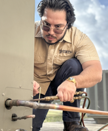 Marcus Puente, an HVAC student at Texas State Technical College’s Harlingen campus, brazes a copper pipe during a lab session.