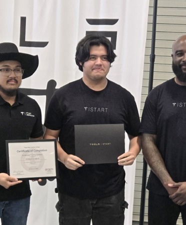 Rodrigo Mejia (center), valedictorian of the Tesla START program at Texas State Technical College’s Fort Bend County campus, receives his advanced technical certificate from instructor Michael Jay (left) and Damian Calliste (right), manager of START service at Tesla, at a graduation ceremony earlier this month.