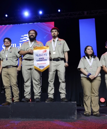SkillsUSA_Mechatronics Muhammad Yasin Adbelwahab and Farid Amirbakhsh (center), Robotics and Industrial Controls students at Texas State Technical College’s Fort Bend County campus, earned a gold medal in the Mechatronics contest at the recent 2026 SkillsUSA Texas Postsecondary Leadership and Skills Conference in Corpus Christi.