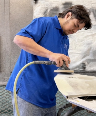 Photo caption: Misael Camarena, of Hillsboro, works on preparing a part of a vehicle for priming on Monday, April 20, at Bird Kultgen Ford in Waco. Camarena is a student in the Auto Collision and Management program at Texas State Technical College’s Waco campus. (Photo courtesy of TSTC.)