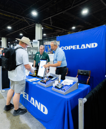 Jaime visits industry 2 Photo caption: Jamie Brannen (left), program team lead for the HVAC and Plumbing and Pipefitting programs at Texas State Technical College’s Waco campus, visits an industry booth during the recent 2026 SkillsUSA TECHSPO held during the recent SkillsUSA National Leadership and Skills Conference at the Georgia World Congress Center in Atlanta, Georgia. (Photo courtesy of TSTC.)