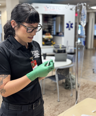 ray mireles-2 paramedic student working with IV