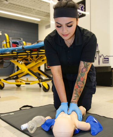 2R7A0959-1 Liana Rios, of Rio Grande City, an Emergency Medical Services student at Texas State Technical College’s Harlingen campus, performs CPR on a medical manikin during a lab session.