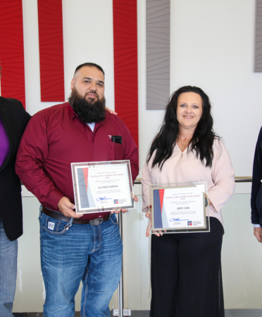 2R7A1495 Bryan Bowling (left), provost at Texas State Technical College’s Fort Bend County campus, Mike Reeser (right), TSTC’s chancellor and CEO, recognize Alonzo Garza and Judy Cox (center), TSTC employees who were recognized as recipients of the college’s 2026 Chancellor's Cornerstone Award.