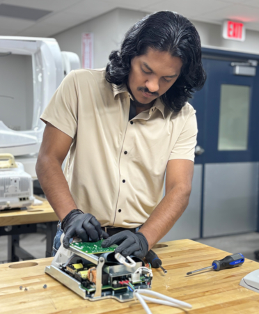 IMG_9874-1 Jose Escobedo, of Pharr, a Biomedical Equipment student at Texas State Technical College’s Harlingen campus, reassembles an X-ray machine during a lab session.