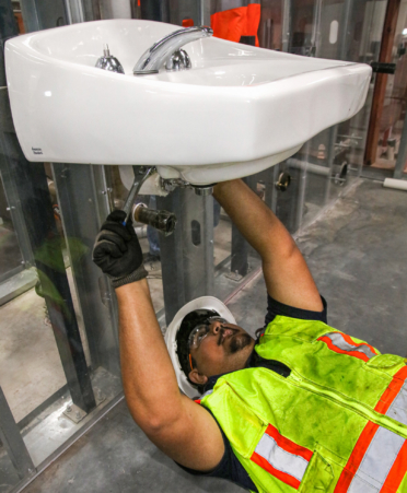 2R7A0849-1-2 Daniel Cantu, a Plumbing and Pipefitting student at Texas State Technical College’s Harlingen campus, works on a sink project during a lab session.