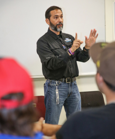 2R7A2755-3 Luis Guajardo, training coordinator at Hacienda Ford Collision, speaks with Auto Collision and Management students about available job opportunities during a recent employer spotlight at Texas State Technical College’s Harlingen campus.