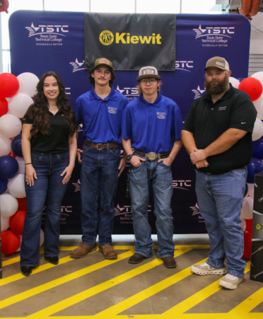 Kiewit Awards - Marshall Workforce development specialist Anna Barnett (left) and heavy haul manager Eric Hornsby (right) represented Kiewit at the recent Tool Kit Reveal at Texas State Technical College’s Marshall campus. Diesel Equipment students Kiefer Dayton Phillips (middle left) and Hayden Monroe Ritchson (middle right) were the Marshall campus’ two awardees. (Photo courtesy of TSTC.)
